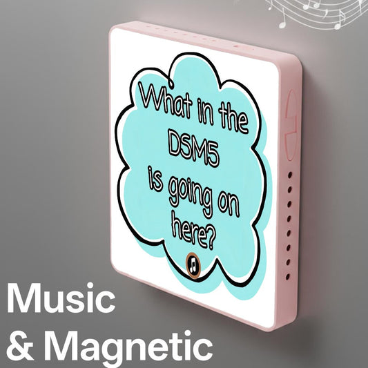 A square pink electronic device with a white front panel and a light blue cloud-shaped graphic containing the text 'What in the DSM5 is going on here?'. White musical notes and the words 'Music & Magnetic' appear on a gray background.
