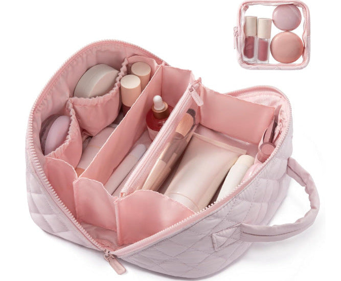 Pink makeup organizer with various cosmetic items on a white background lay flat makeup bag organizer