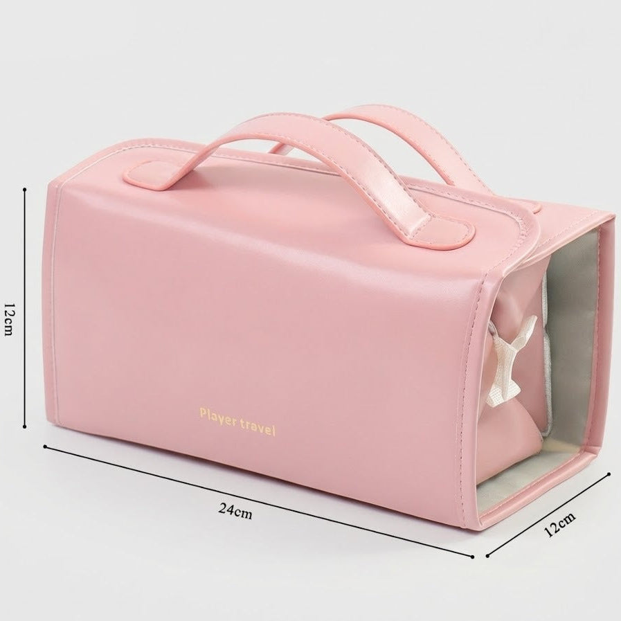 Pink rectangular travel toiletry bag with dual top handles, shown on a light gray background with dimension lines indicating 24cm length, 12cm height, and 12cm width. A small gold 'Pleasant travel' logo appears on the front.