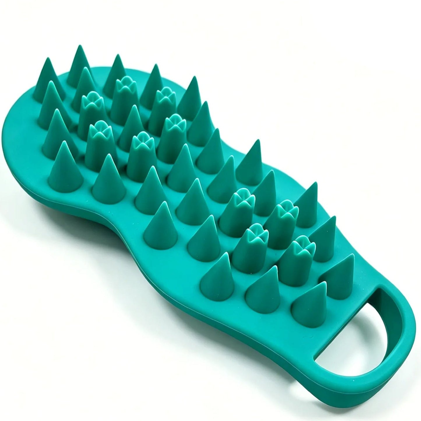 Green silicone brush with textured surface on a white background