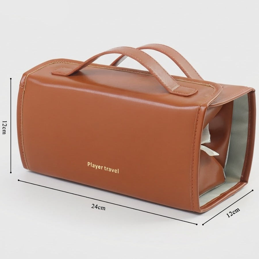 A brown faux-leather cosmetic travel bag with dual top handles, shown with dimension lines indicating 24cm length, 12cm width, and 15cm height on a light gray background.