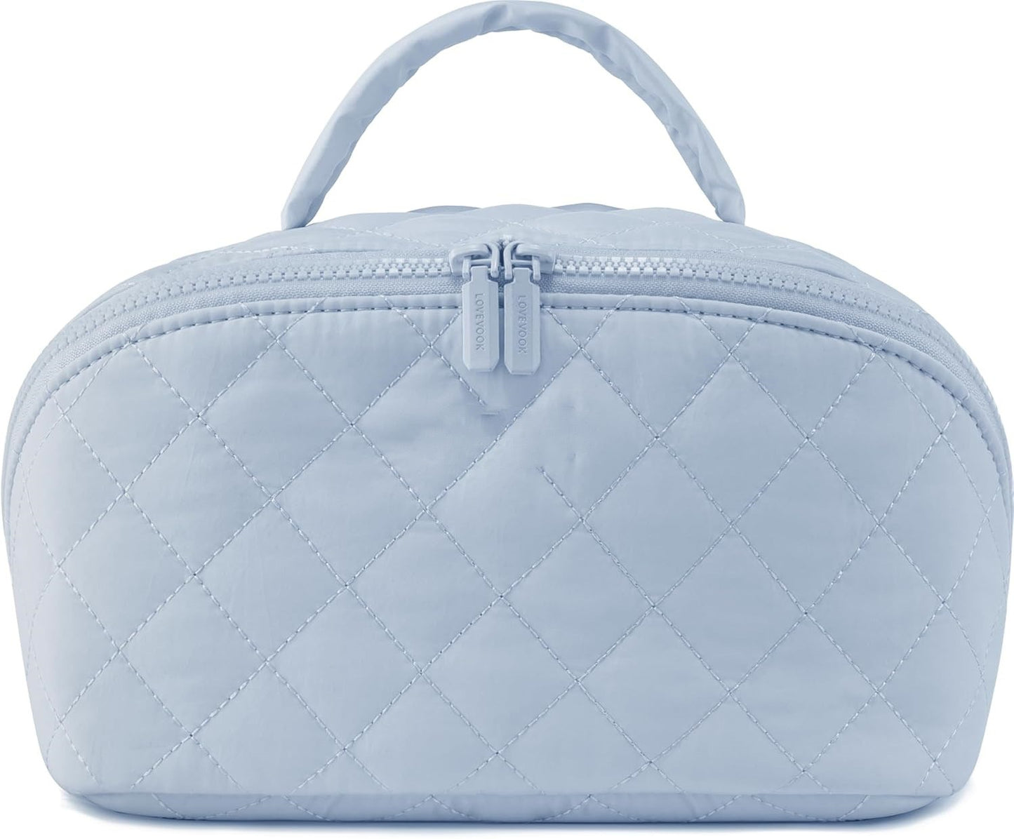 Light blue quilted cosmetic bag with a zipper on a white background