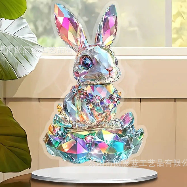 Crystal looking rabbit on a stand with a blurred indoor background