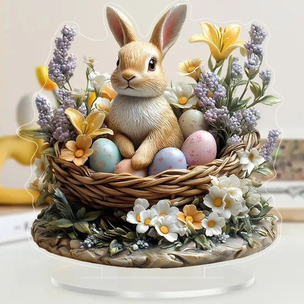 Decorative item with a rabbit figurine, eggs, and flowers on a white surface.