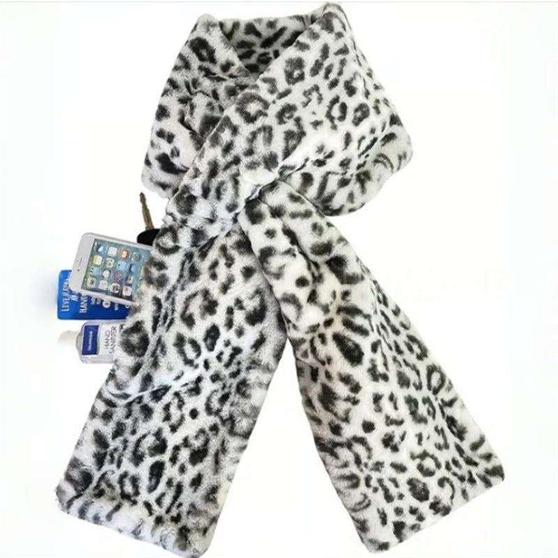 Leopard print scarf with a phone and charger showing out of a secret pocket on a white background