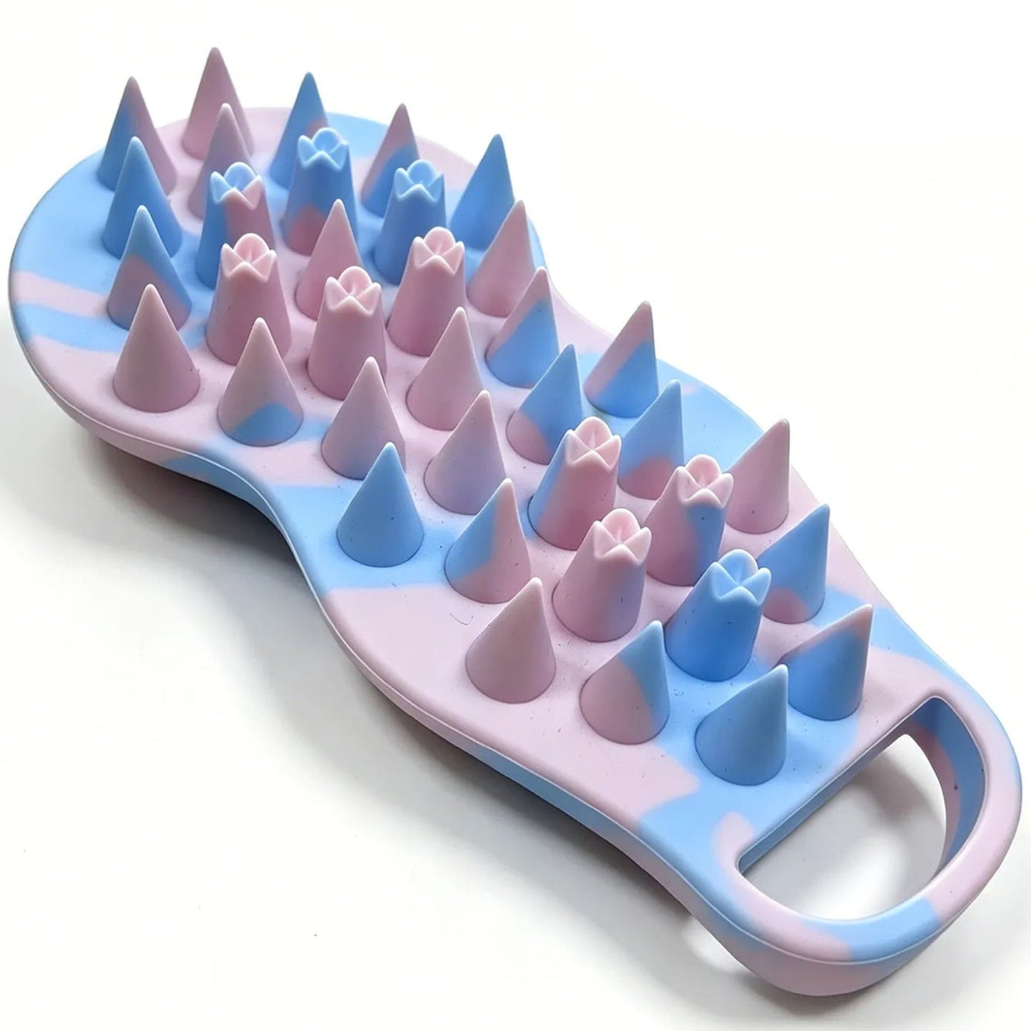 Pink and blue pastel-colored massage brush with spike-like design on a white background