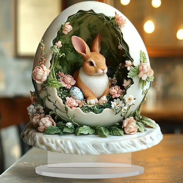 Decorative egg with a rabbit and floral design on a stand