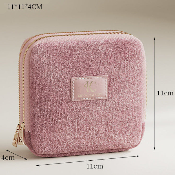 Pink textured pouch with dimensions on a beige background