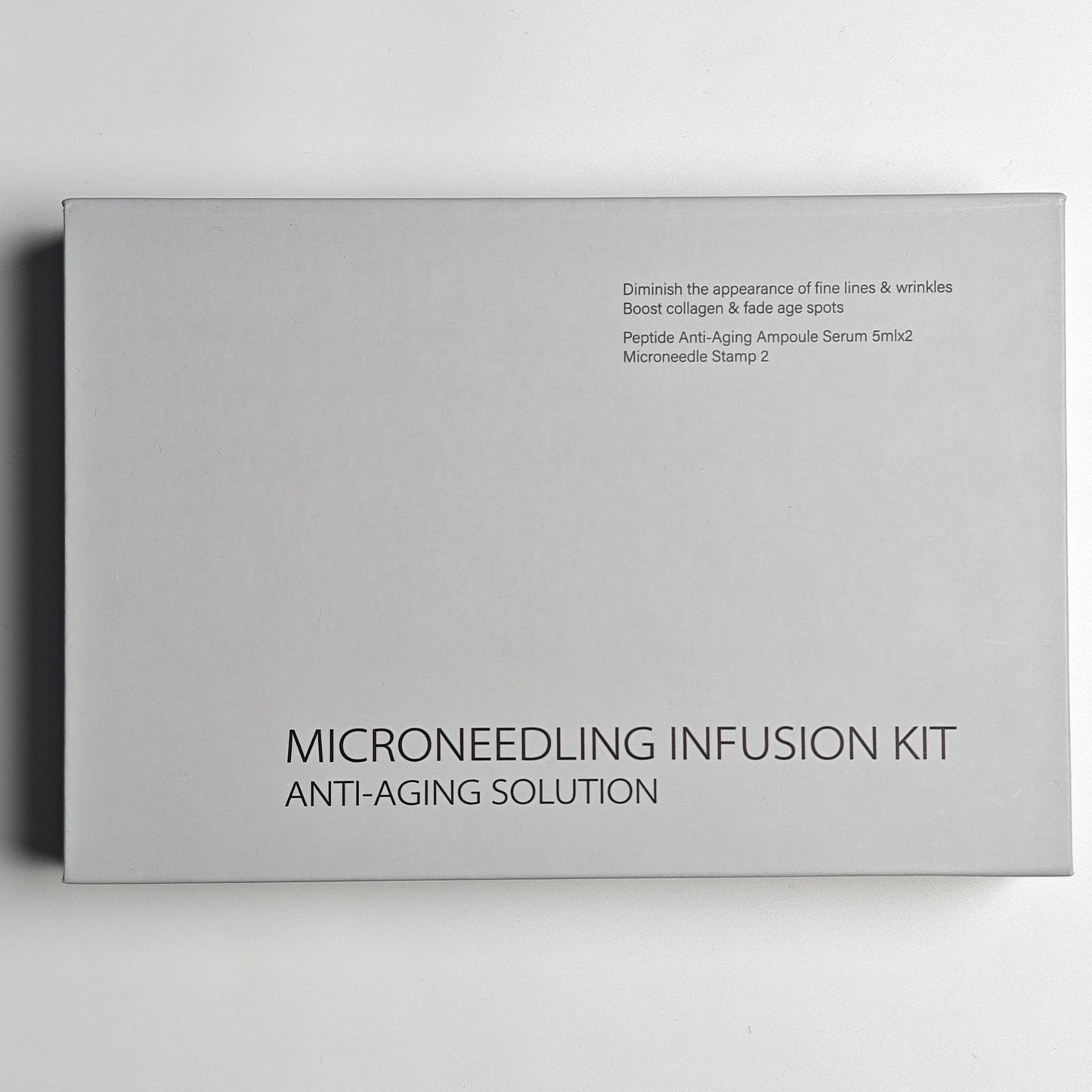 Microneedling infusion kit packaging on a light gray background