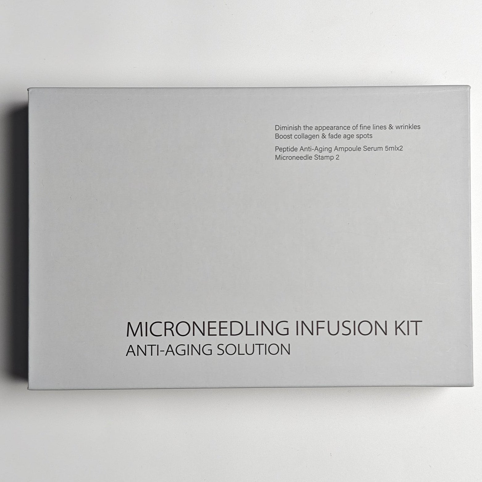 Microneedling infusion kit packaging on a light gray background