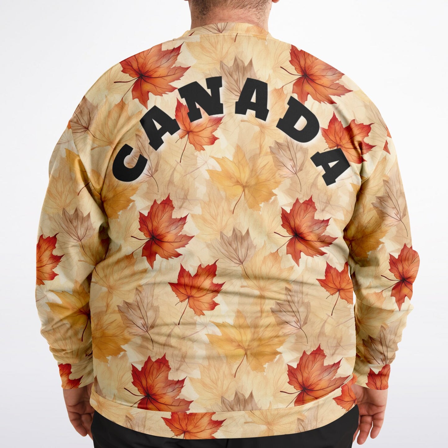 Sweatshirt with autumn leaf pattern and 'CANADA' text on a plain background