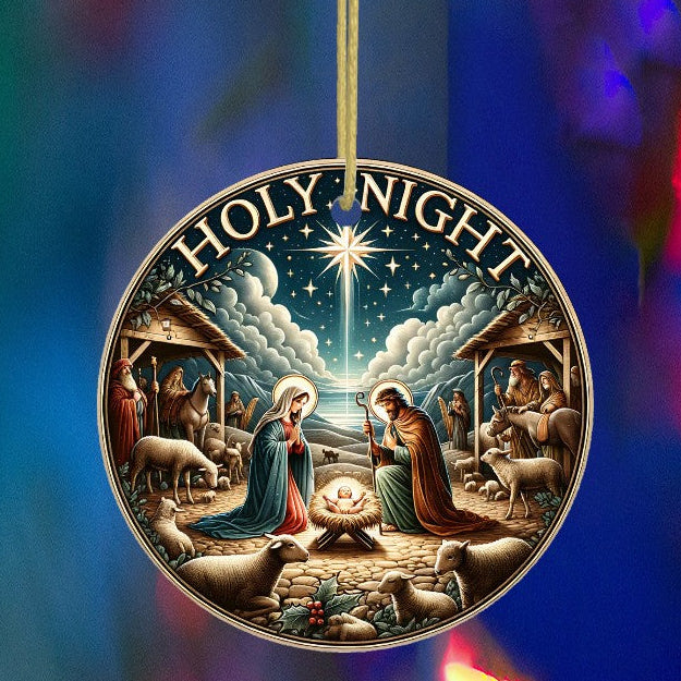 Decorative Christmas ornament with nativity scene and 'Holy Night' text, hanging against a colorful blurred light background.