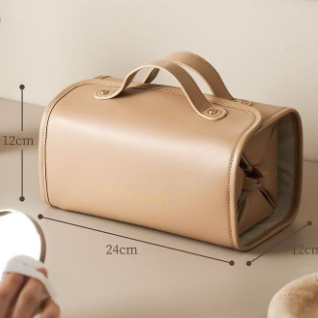 Brown makeup bag with dimensions on a neutral background