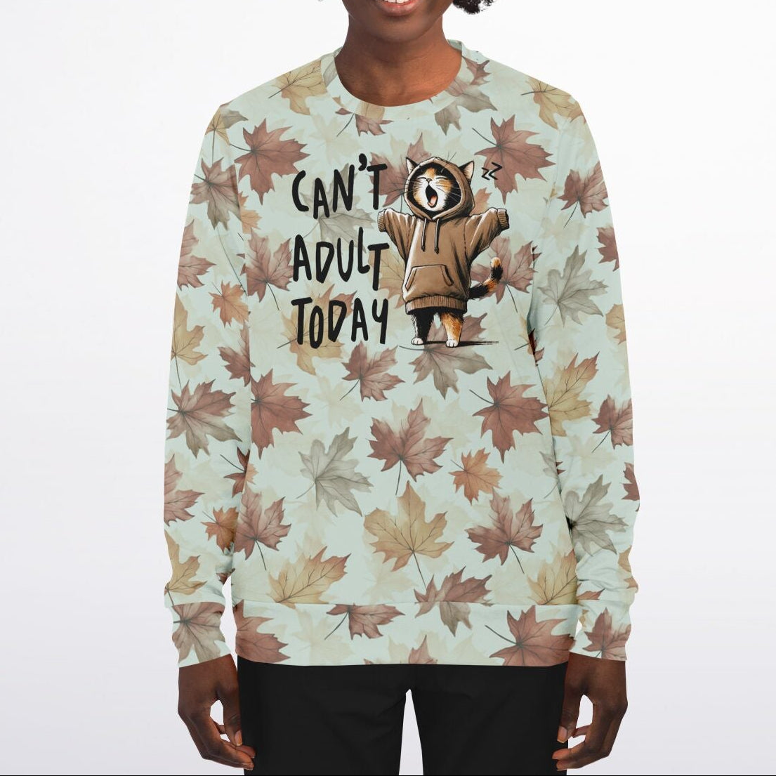 Person wearing a sweater with a leaf pattern and text 'CAN'T ADULT TODAY' on a white background