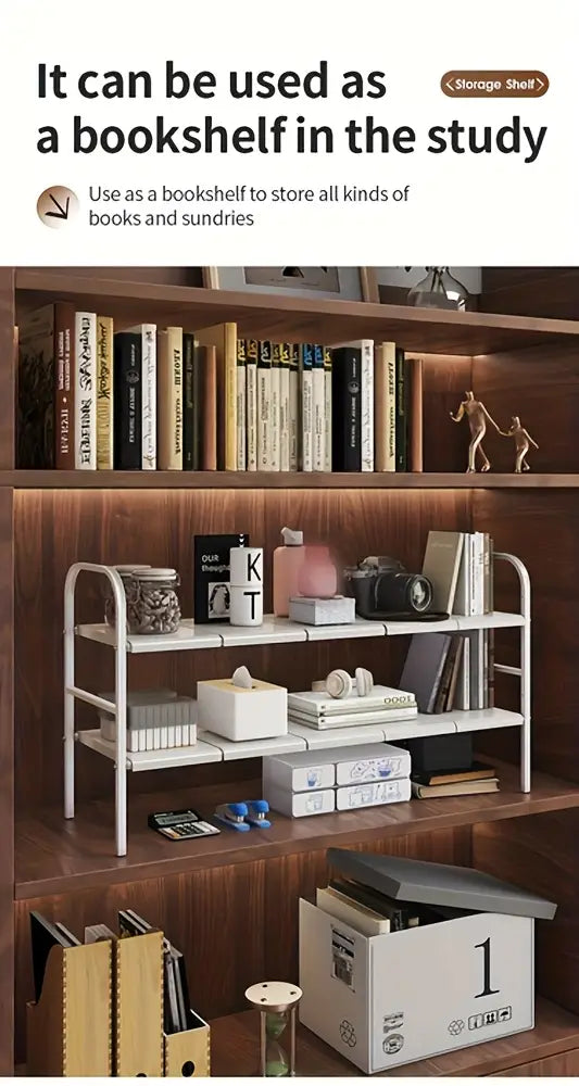 Wooden bookshelf with white shelves containing books, decor items, and boxes.
